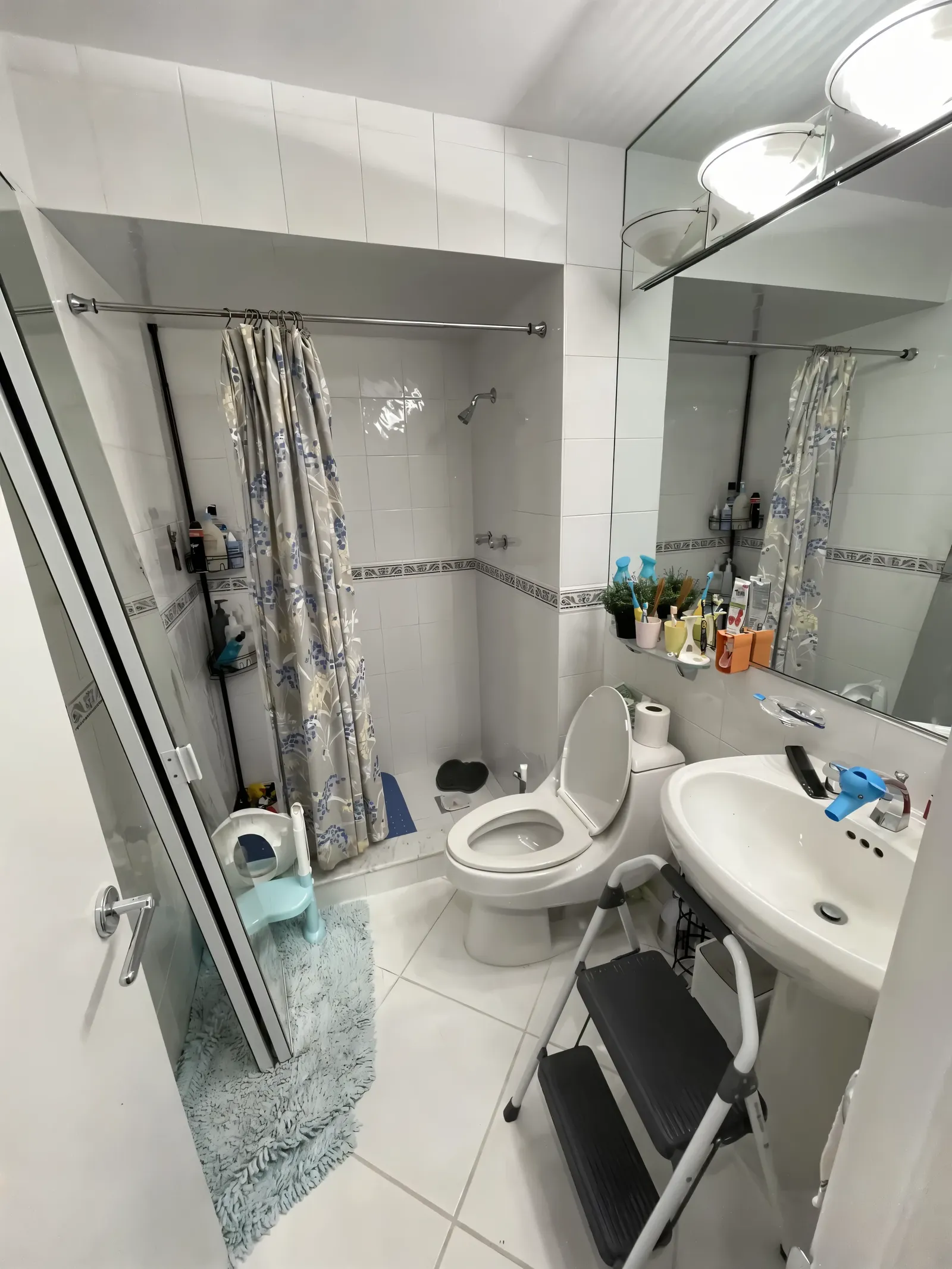 Dated bathroom with a tub-shower combo and old tile before the remodel